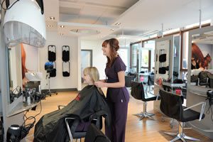 Hairdressing Student in the Evolve Salon with a Client Discussing the Hair Style