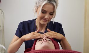 Beauty Therapy Student performing a facial on a client